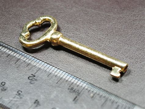 gold metal house key|old fashioned skeleton keys.